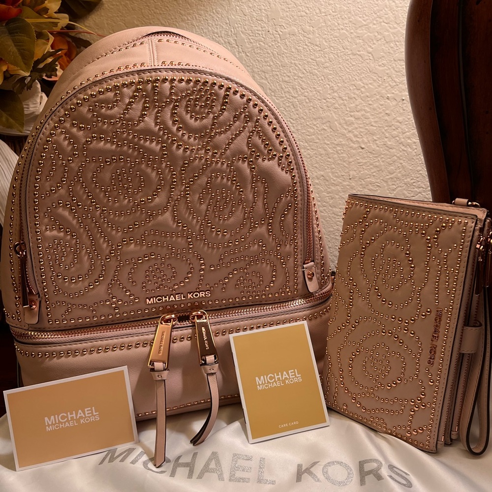 Michael Kors studded backpack and matching wallet.